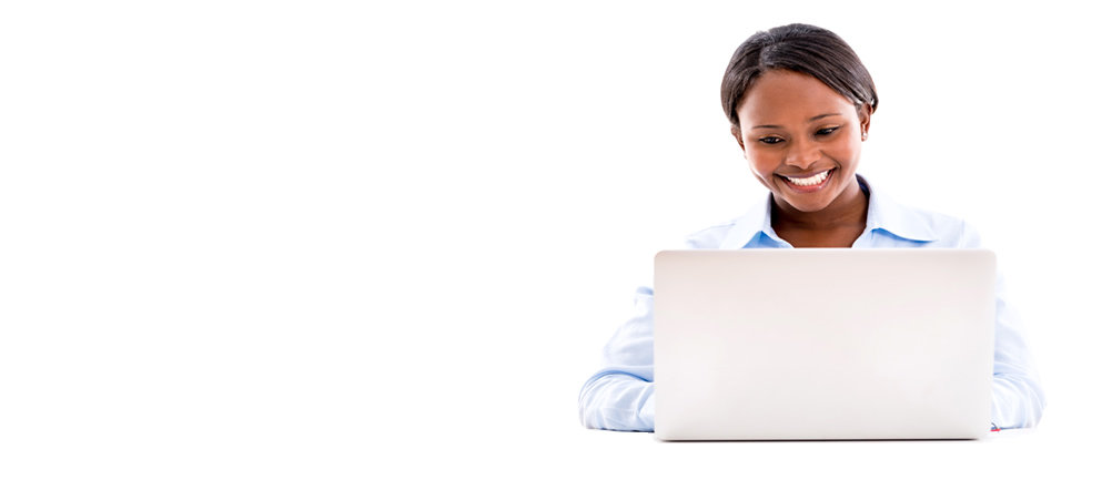 Young lady is smiling, looking down at her laptop computer